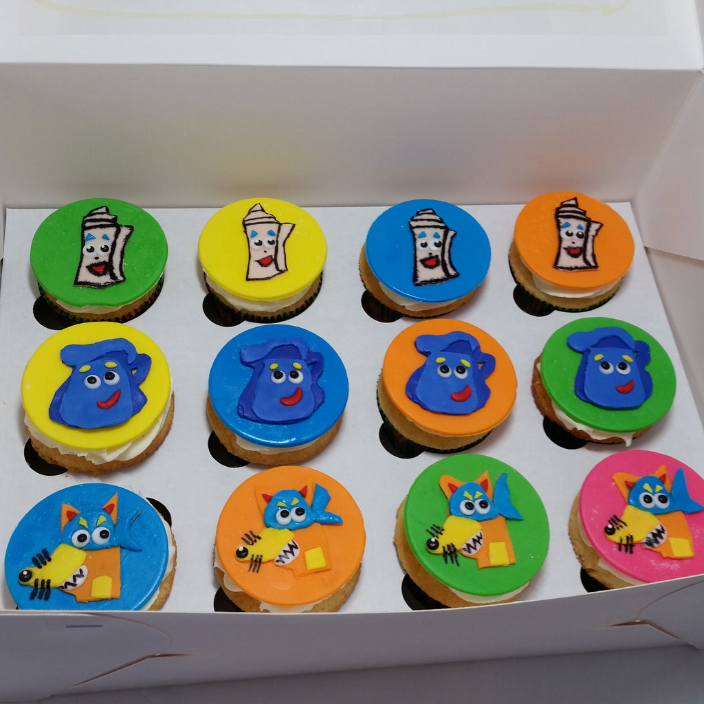 Dora Themed Vanilla Cupcakes with Flat Fondant Toppers $4.75/Cupcake. Minimum Order 1 Dozen